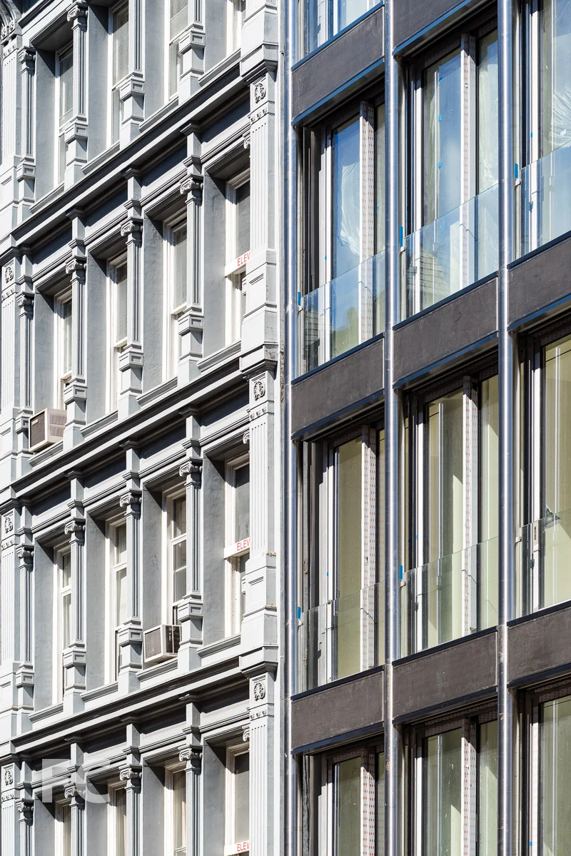 Close-up of the south façade (right) adjacent to the cast iron façade of the E. V. Haughwout Building built in 1857.