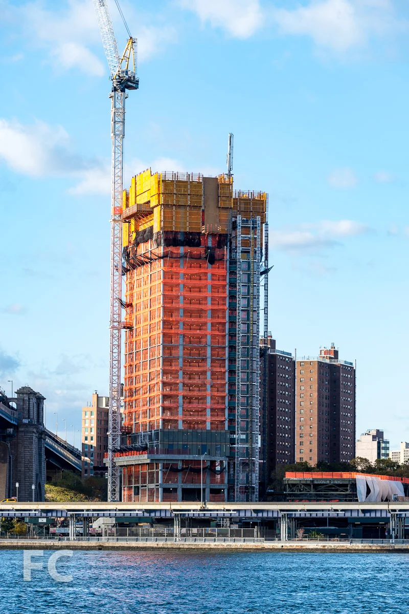 One Manhattan Square rising on the East River waterfront.