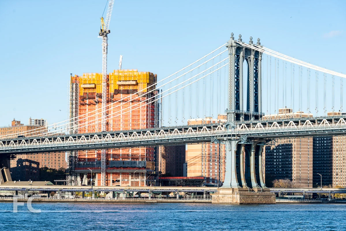 One Manhattan Square rising next to the Manhattan Bridge.
