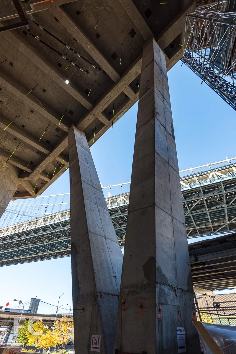 Concrete columns at the ground floor entry.
