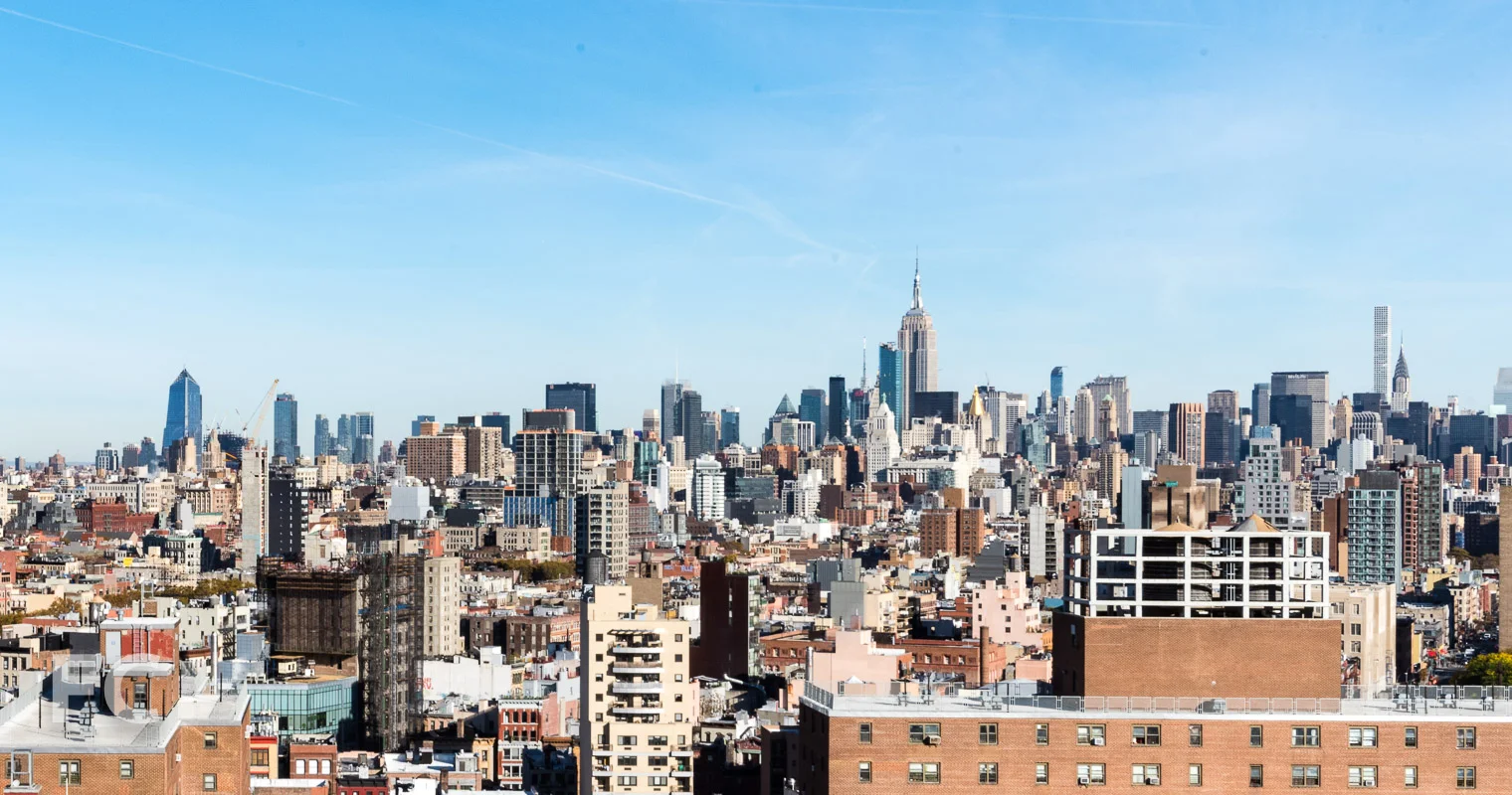 Panoramic views encompass Hudson Yards (left), the Empire State Building (center), and 432 Park Avenue (right).