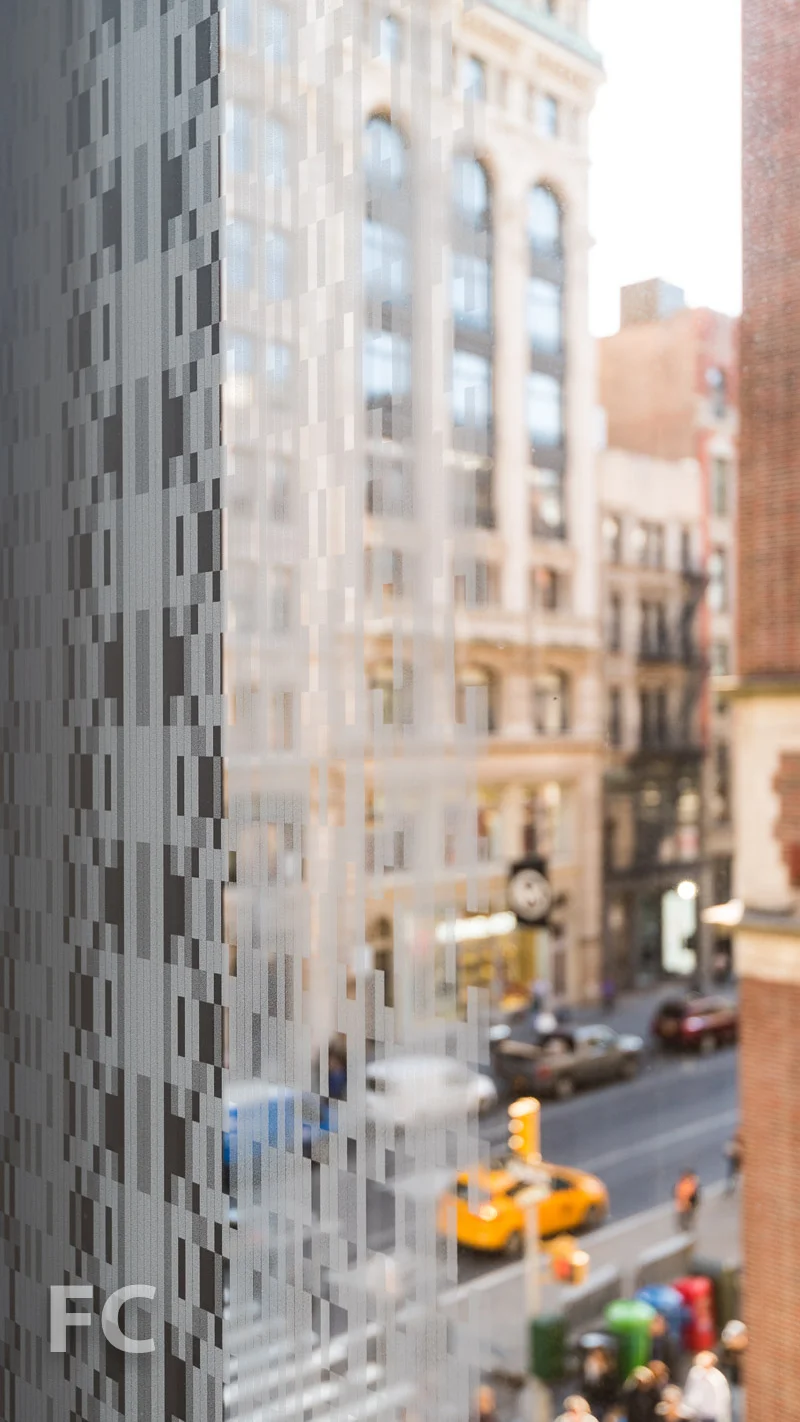 Frit pattern surrounding the glass panels.