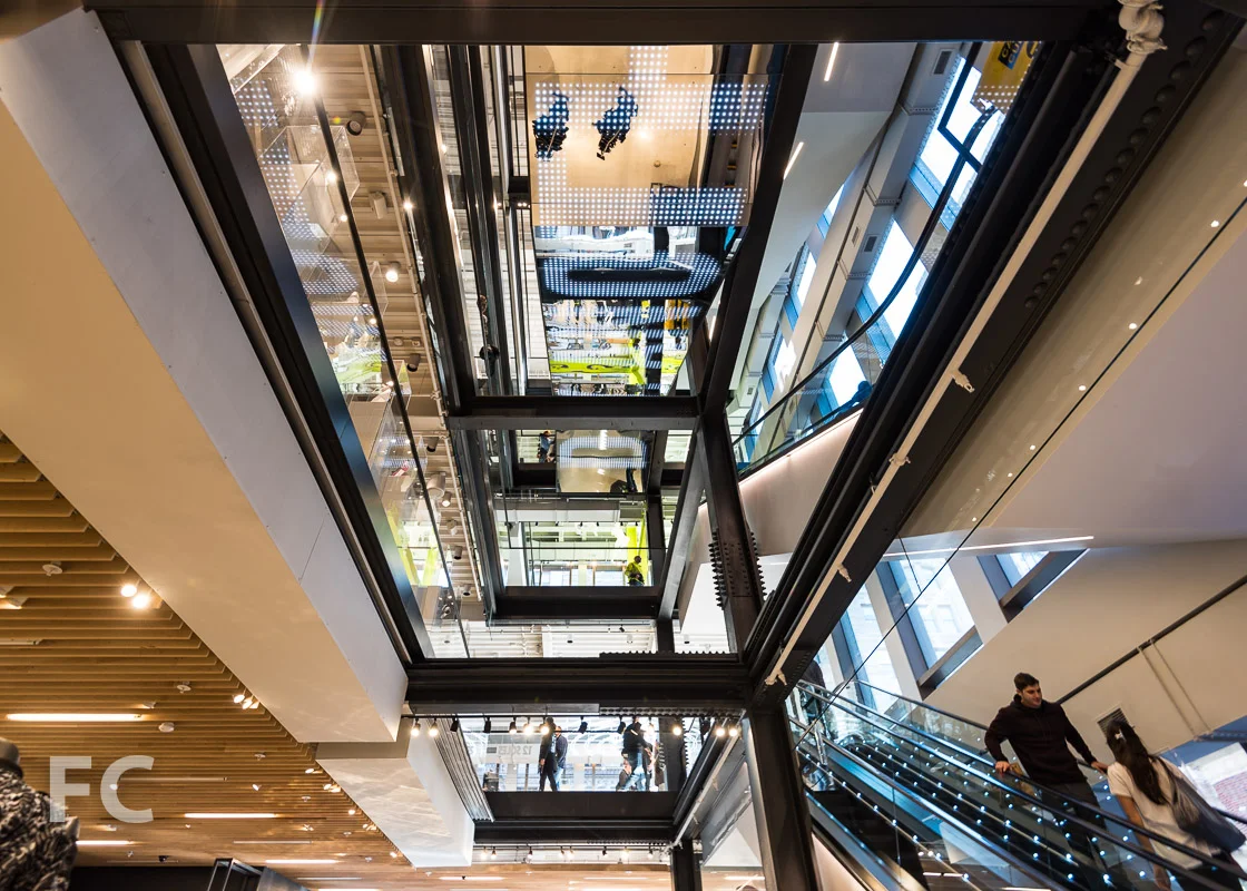 Looking up at the central circulation spine of the store.