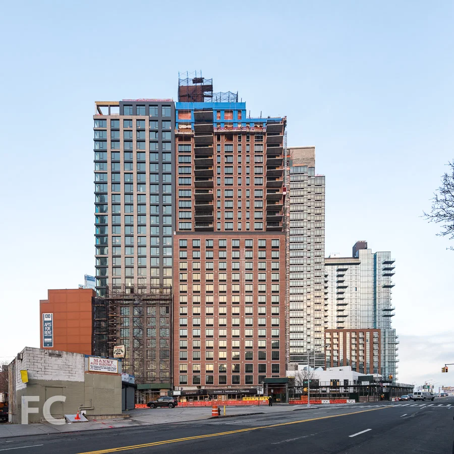 West facade of Watermark Court Square (left) and The Edison (center), and .