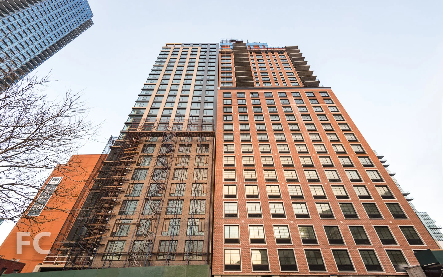 Looking up at the west facade of Watermark Court Square (left) and The Edison (right).
