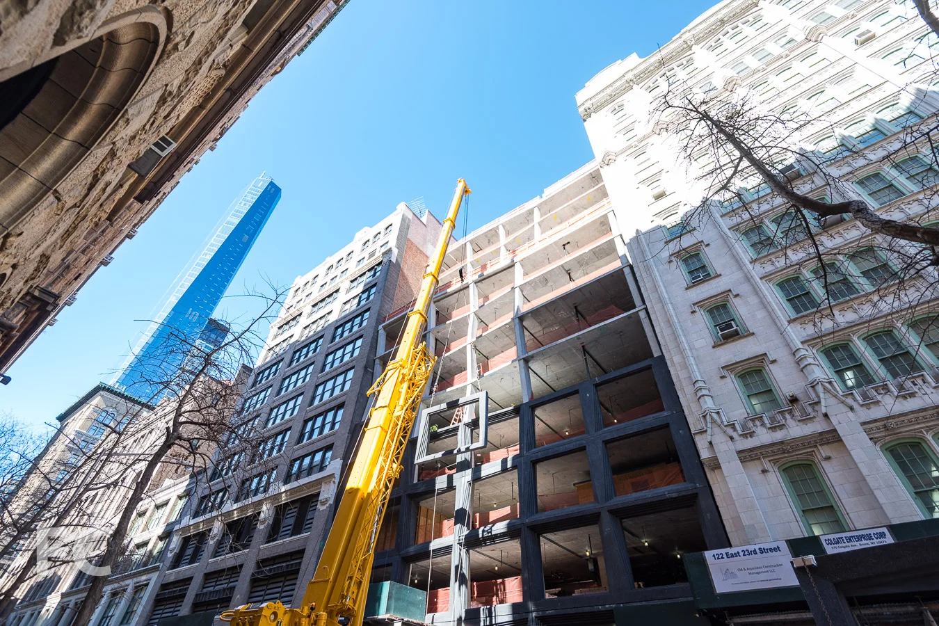 Crane lifts precast panel into place on the East 22nd Street façade.