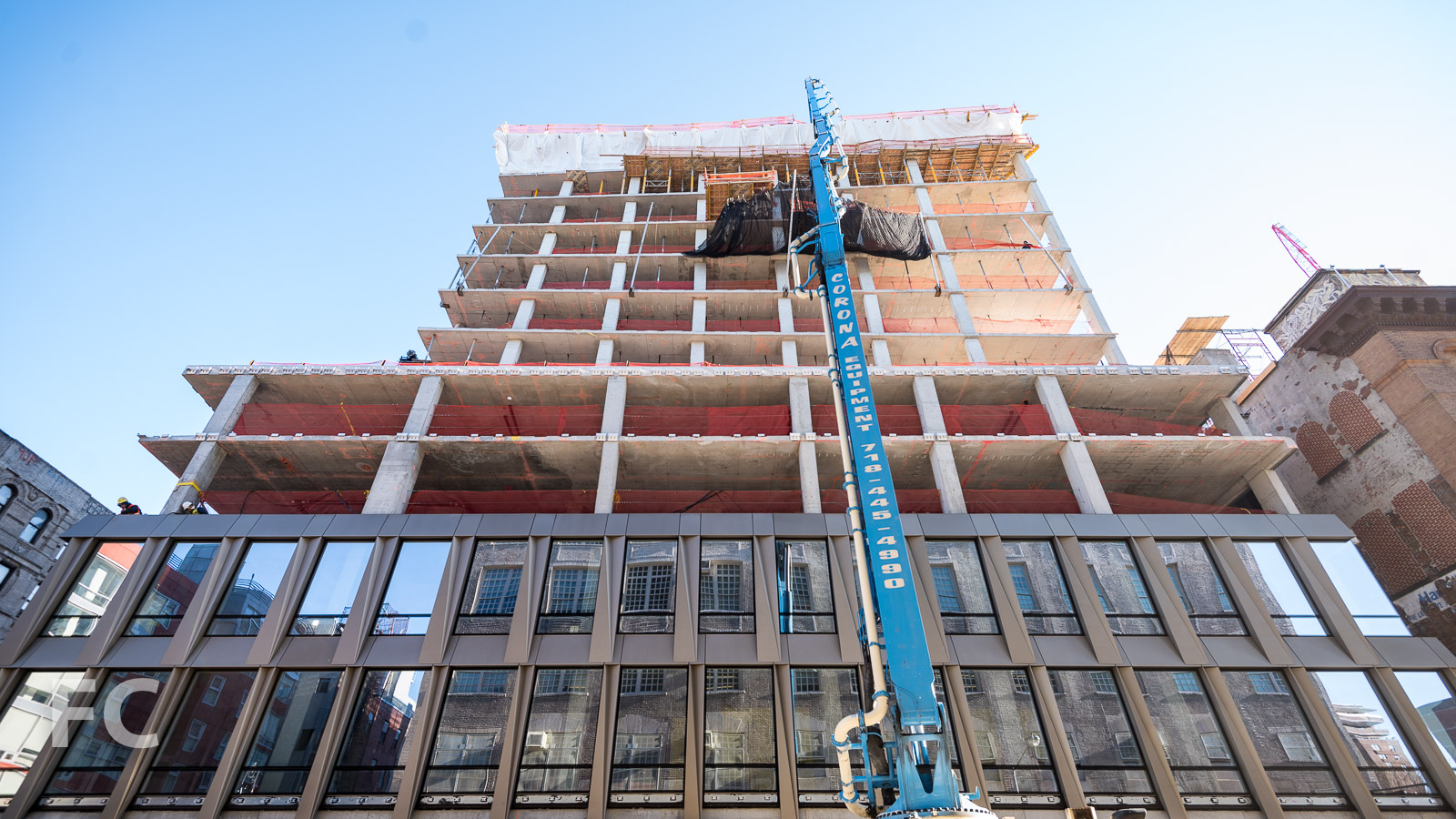 Looking up at the south facade from Broome Street.