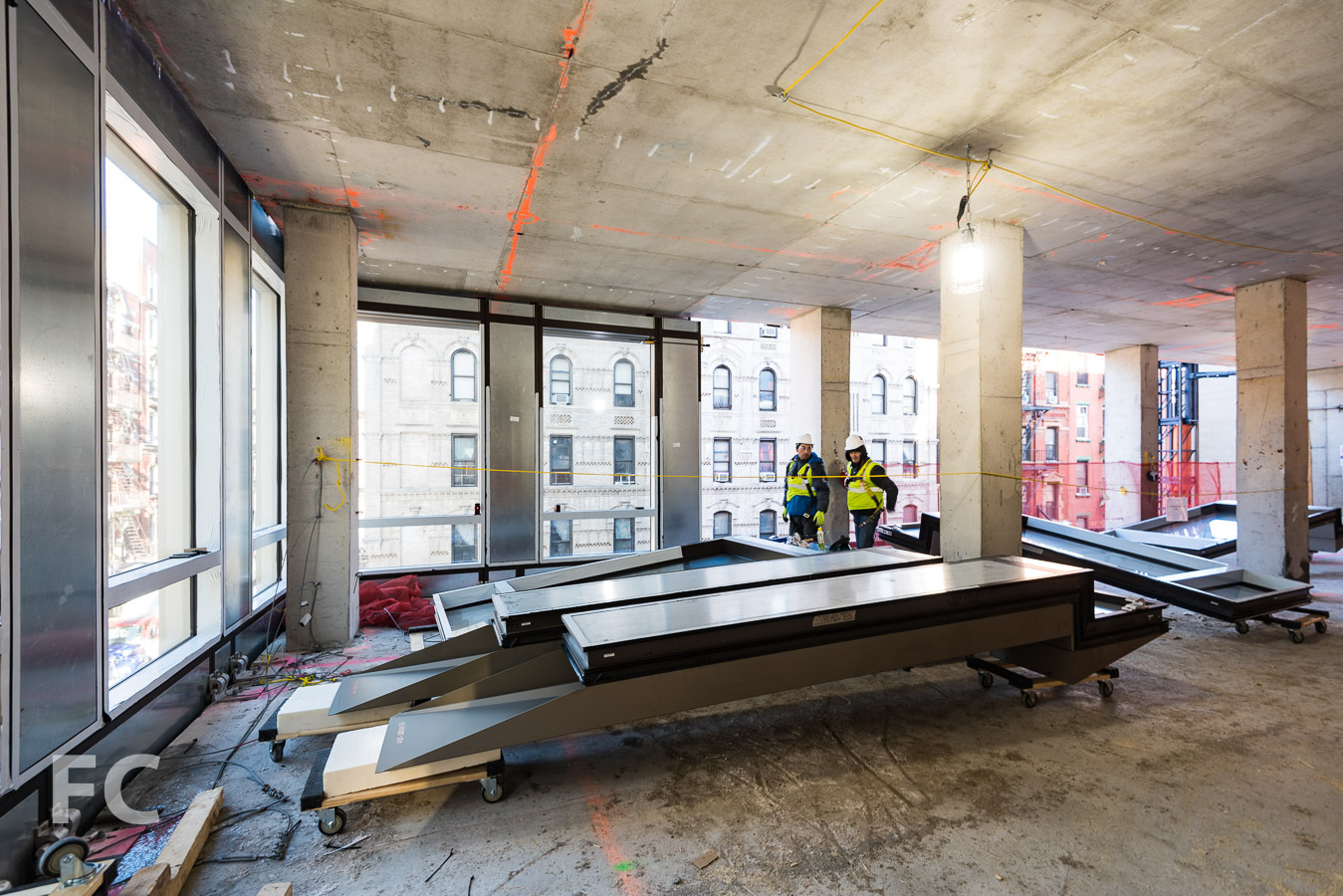 Curtain wall panels await installation.