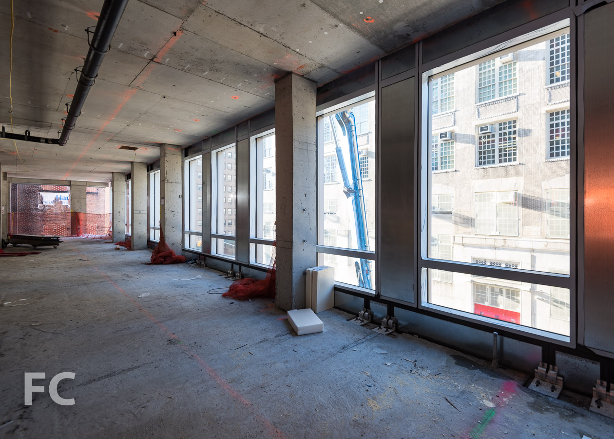 Curtain wall panels installed on the third floor.