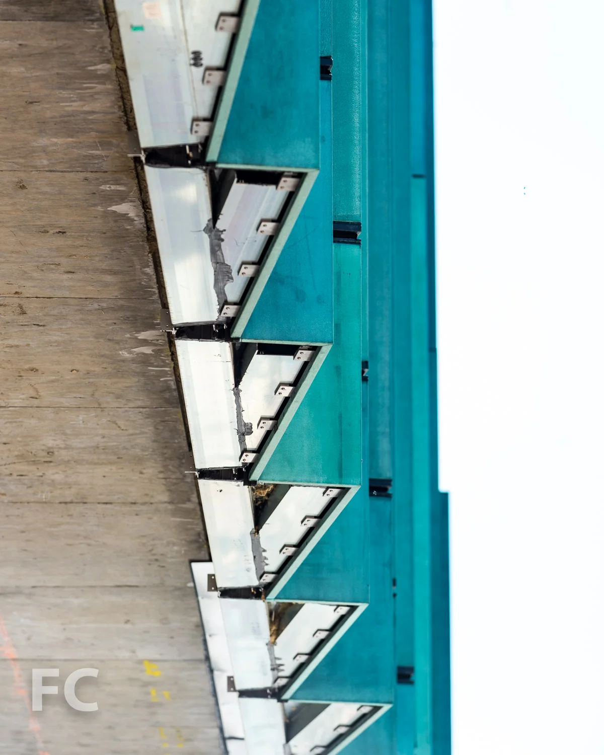 Close-up of the curtain wall connection to the slab.