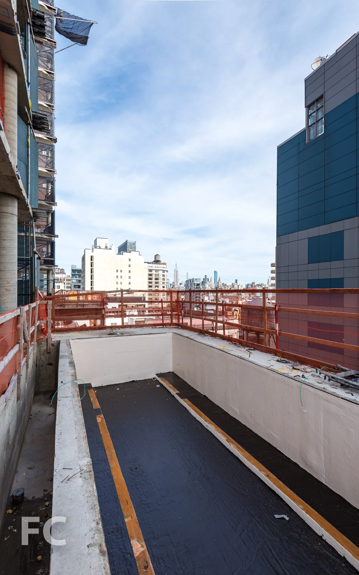 An outdoor pool under construction on the 11th floor terrace.