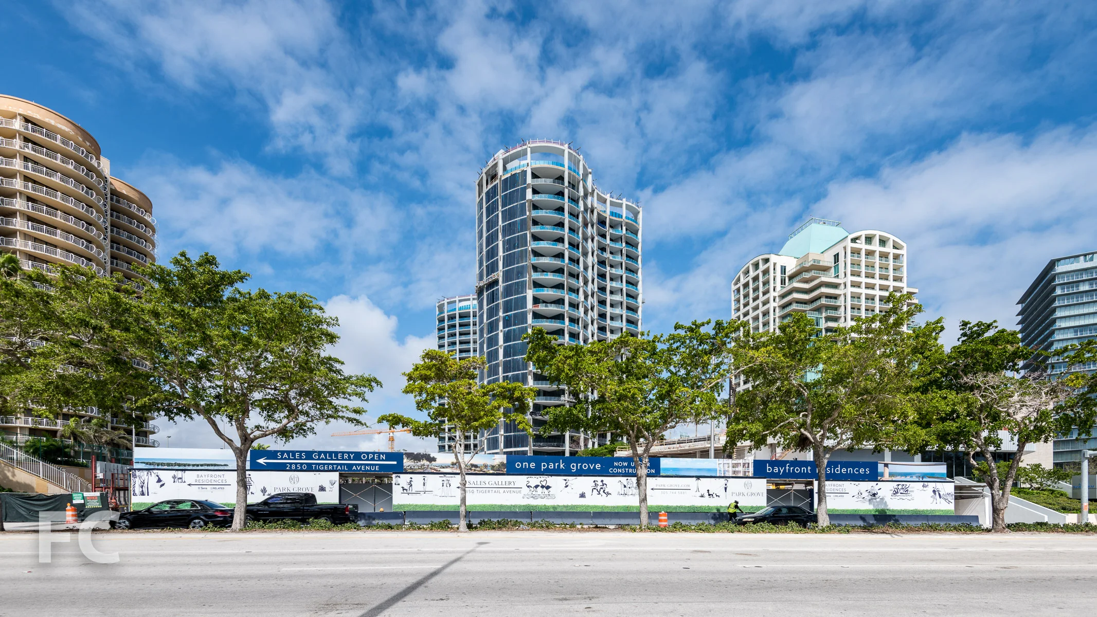 South facade of the Park Grove Club Residences (center) and Two Park Grove (right), with the site of One Park Grove in the foreground.