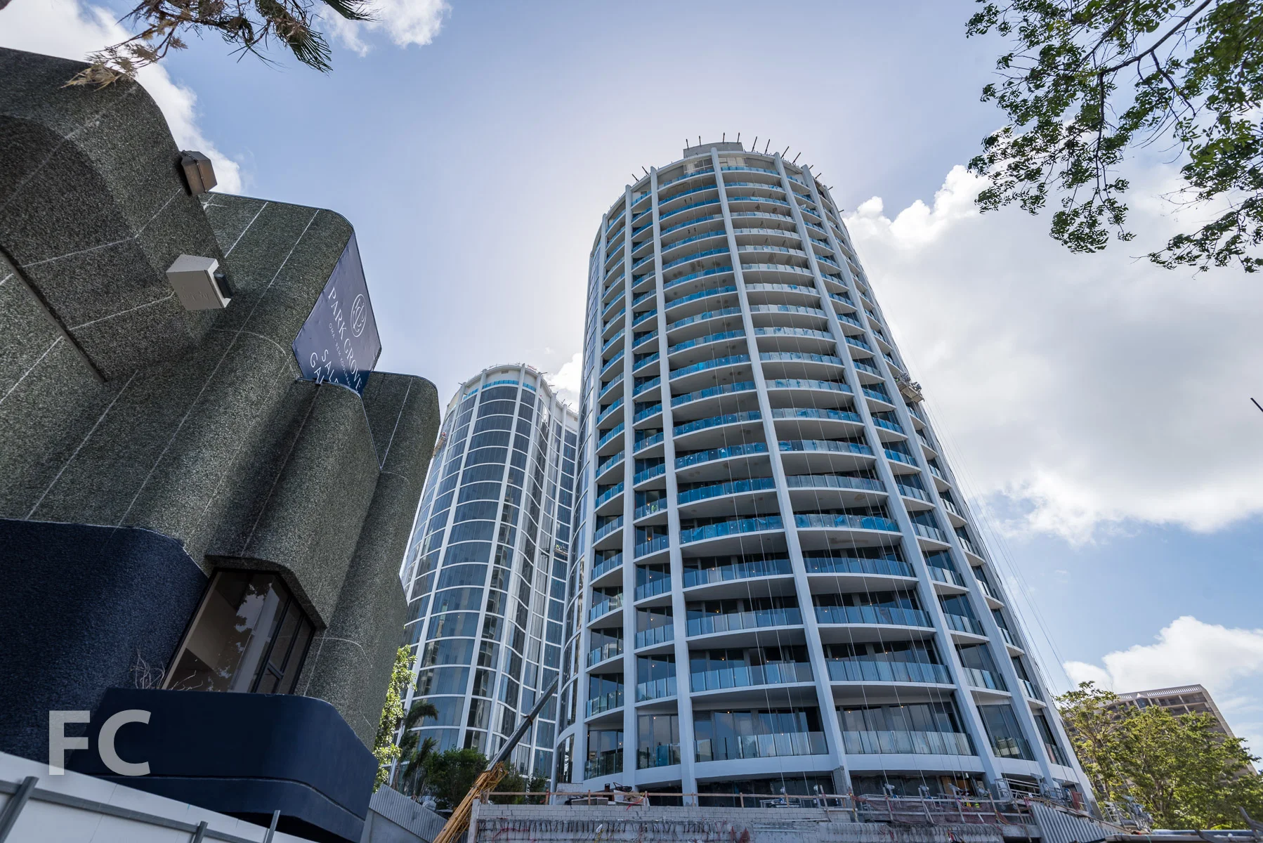 Looking up at the north facade of the Park Grove Club Residences.