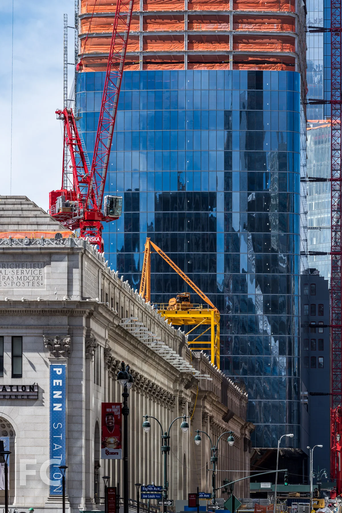 Close-up of the James A. Farley Post Office building (foreground) and One Manhattan West (background).