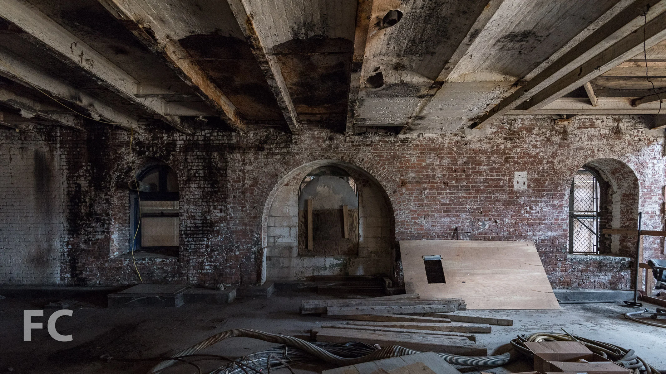 Inside the refinery building before renovation begins.