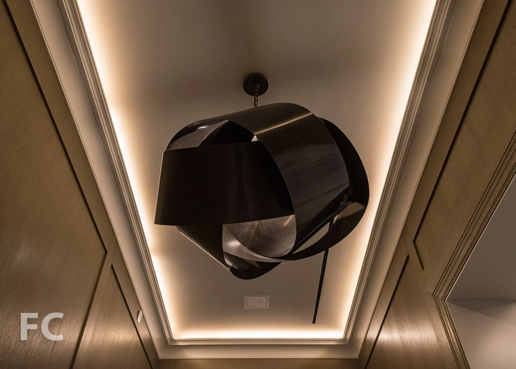 Close-up of a chandelier at the residential entry corridor.