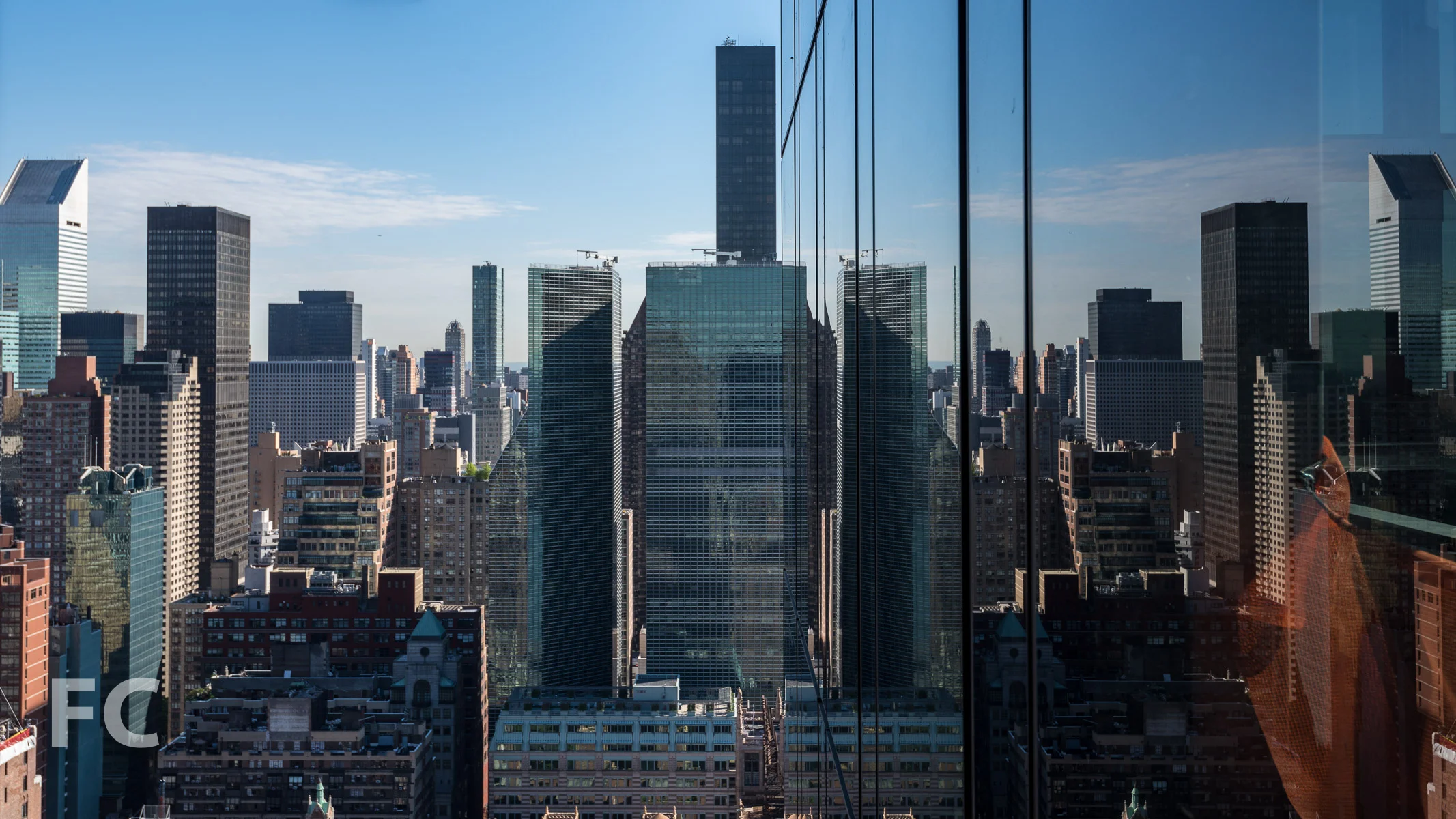 Midtown reflections on the tower facade.