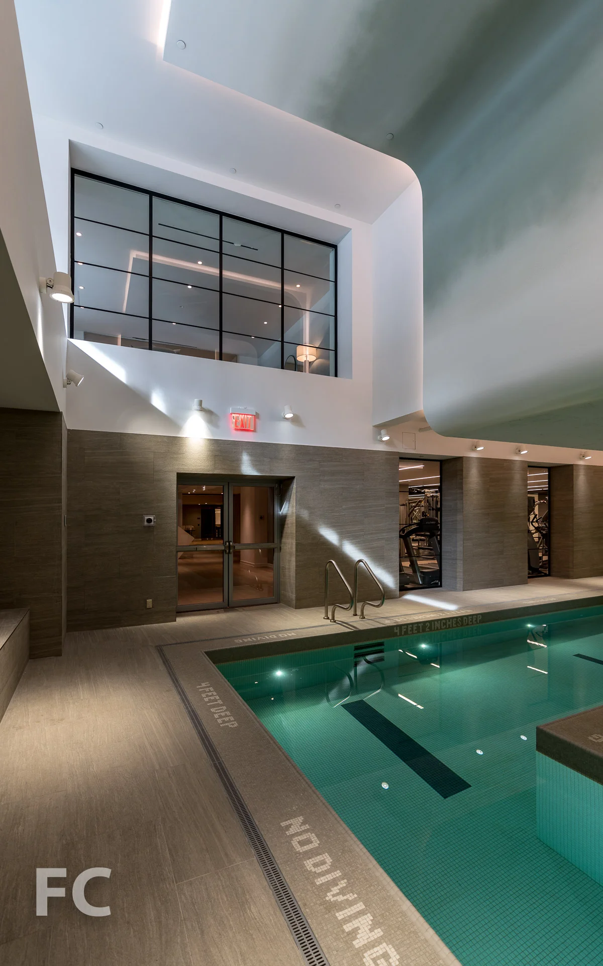 Pool with view to ground floor lounge at 90 Lexington.