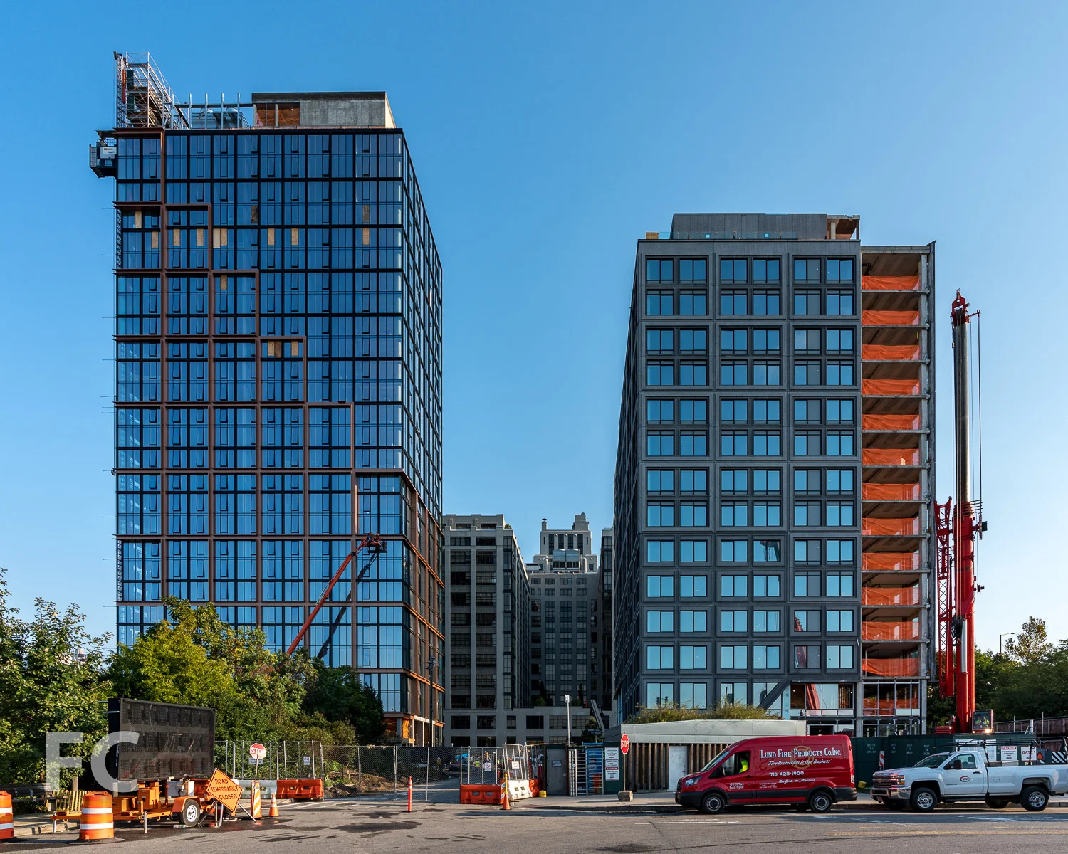 South façade of 15 Bridge Park Drive (right) and Quay Tower (left).