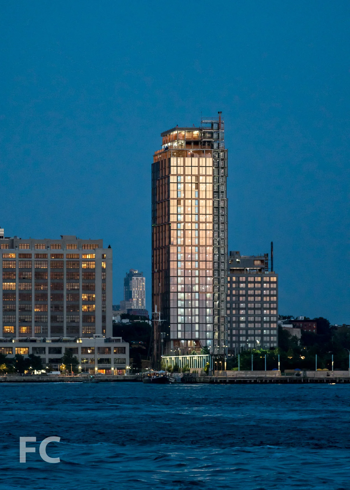 West façade of 15 Bridge Park Drive (far right) and Quay Tower (right) from the East River.
