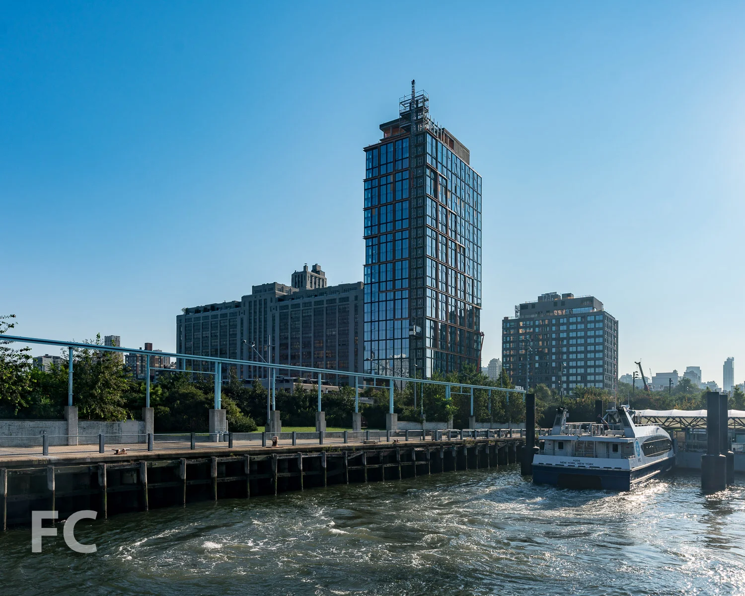 Southwest corner of Quay Tower (left) and 15 Bridge Park Drive (right) from the East River.