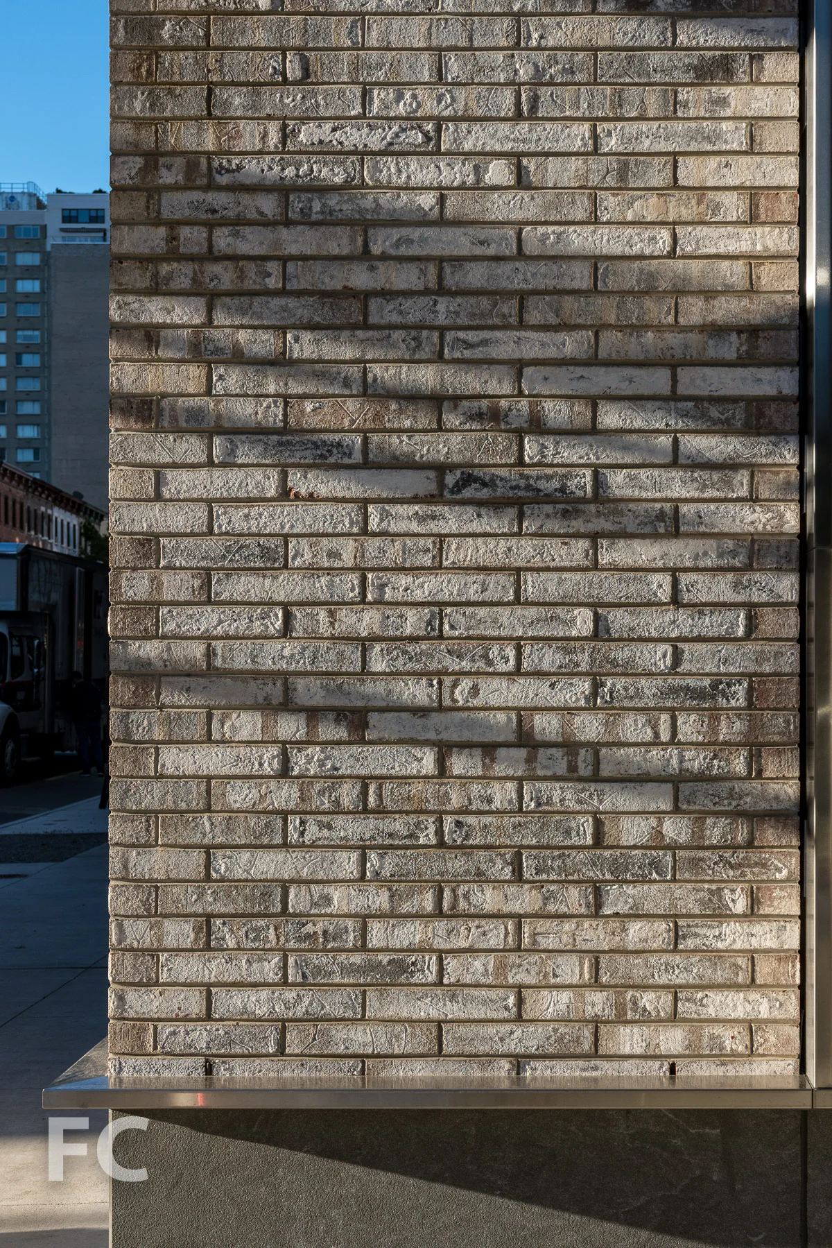 Brick facade detail at the ground floor.