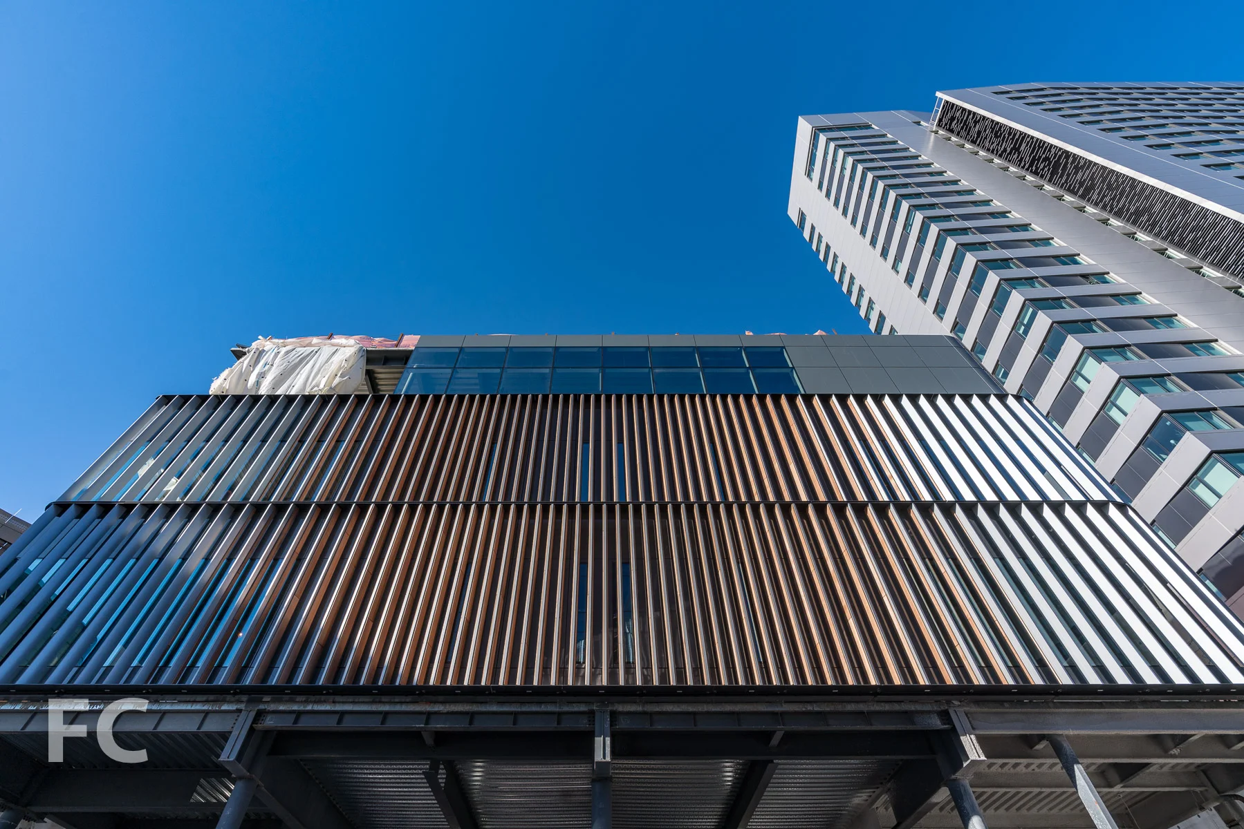 Looking up at the south facade of the Executive Education Center.