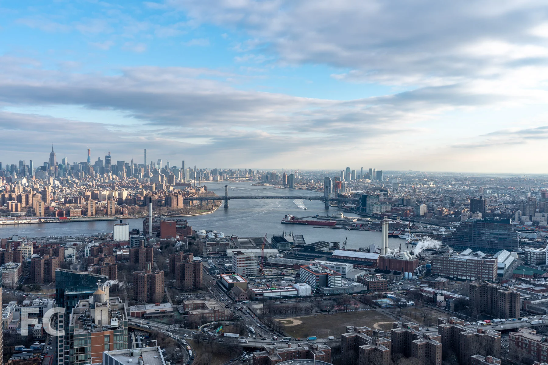View north towards Lower Manhattan and the Brooklyn waterfront from an upper floor.