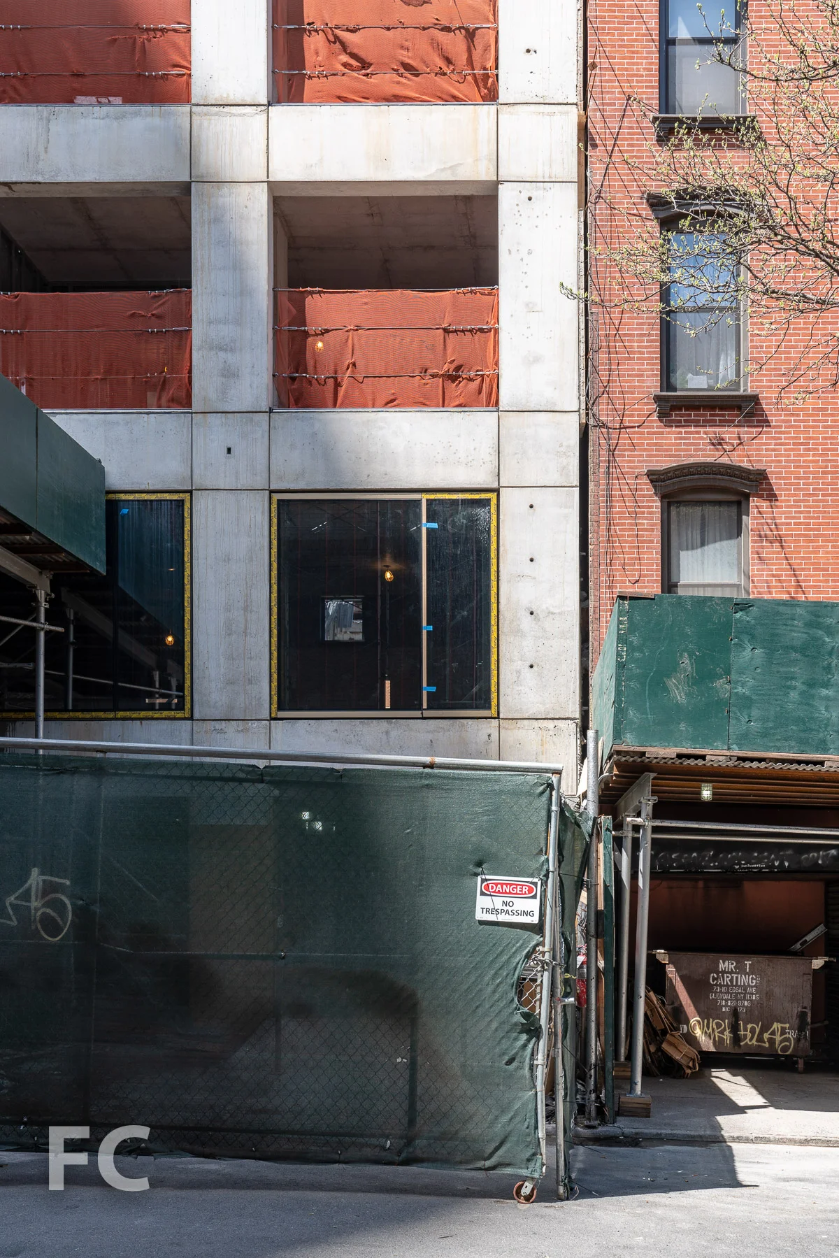 Window installation underway at the east facade.