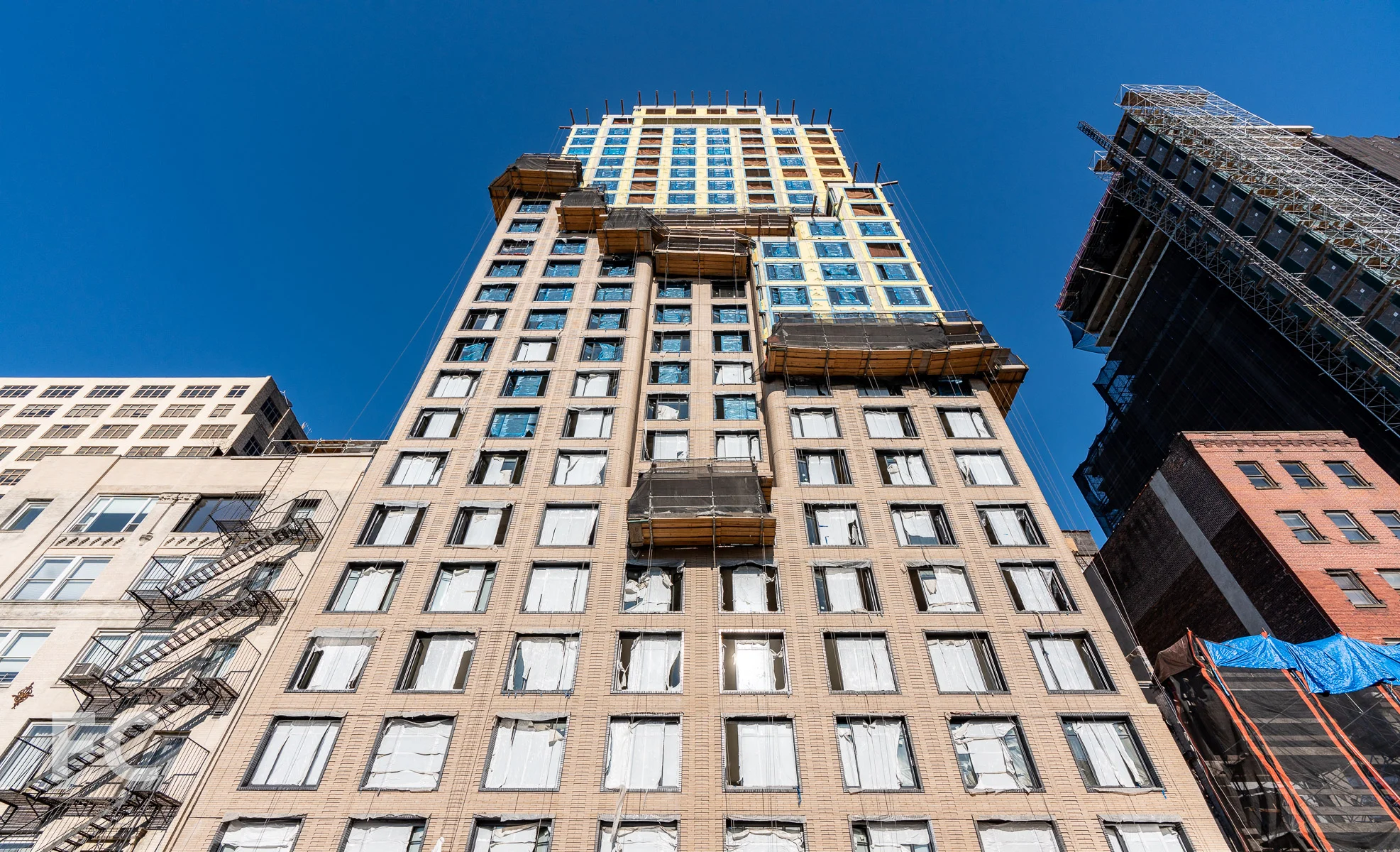Looking up at the west facade from Greenwich Street..