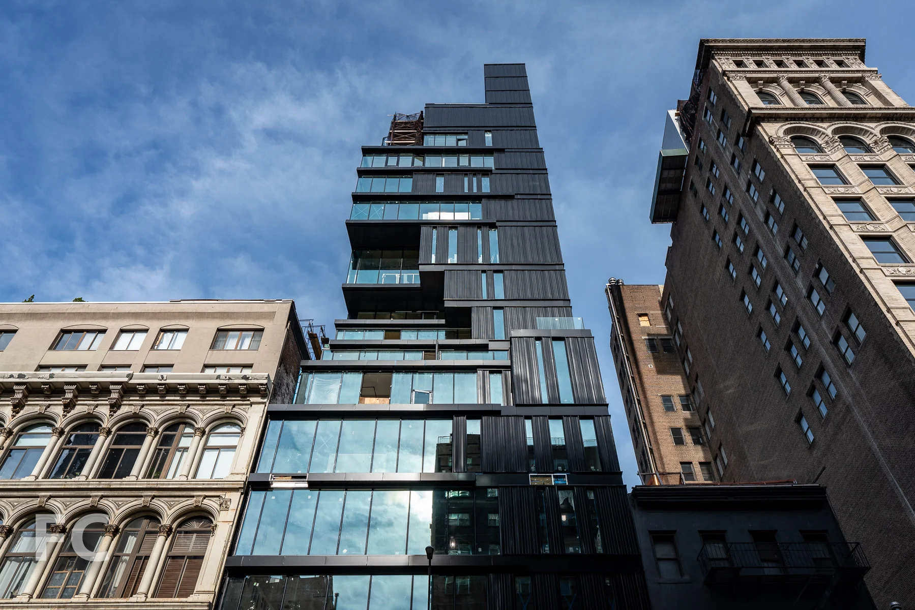 Looking up at the east facade from Broadway.