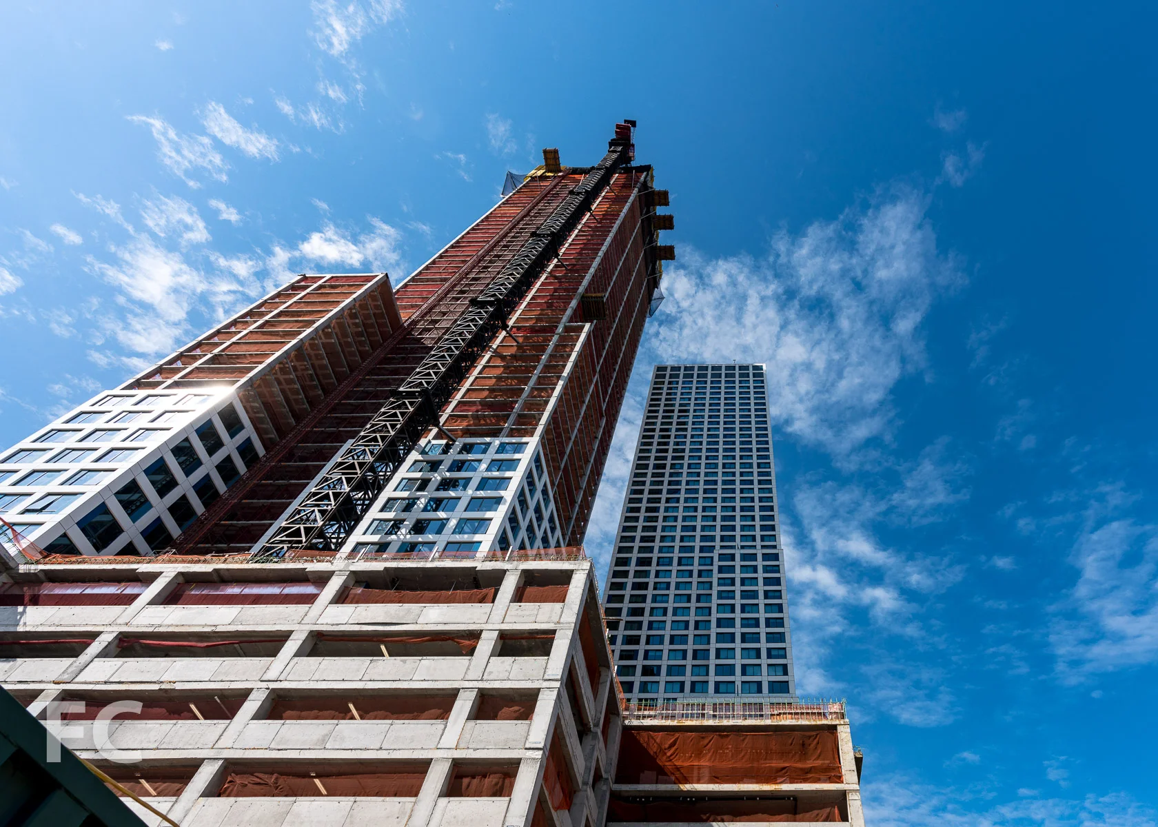 Looking up at the east facade of phase one (right) and phase two (left).