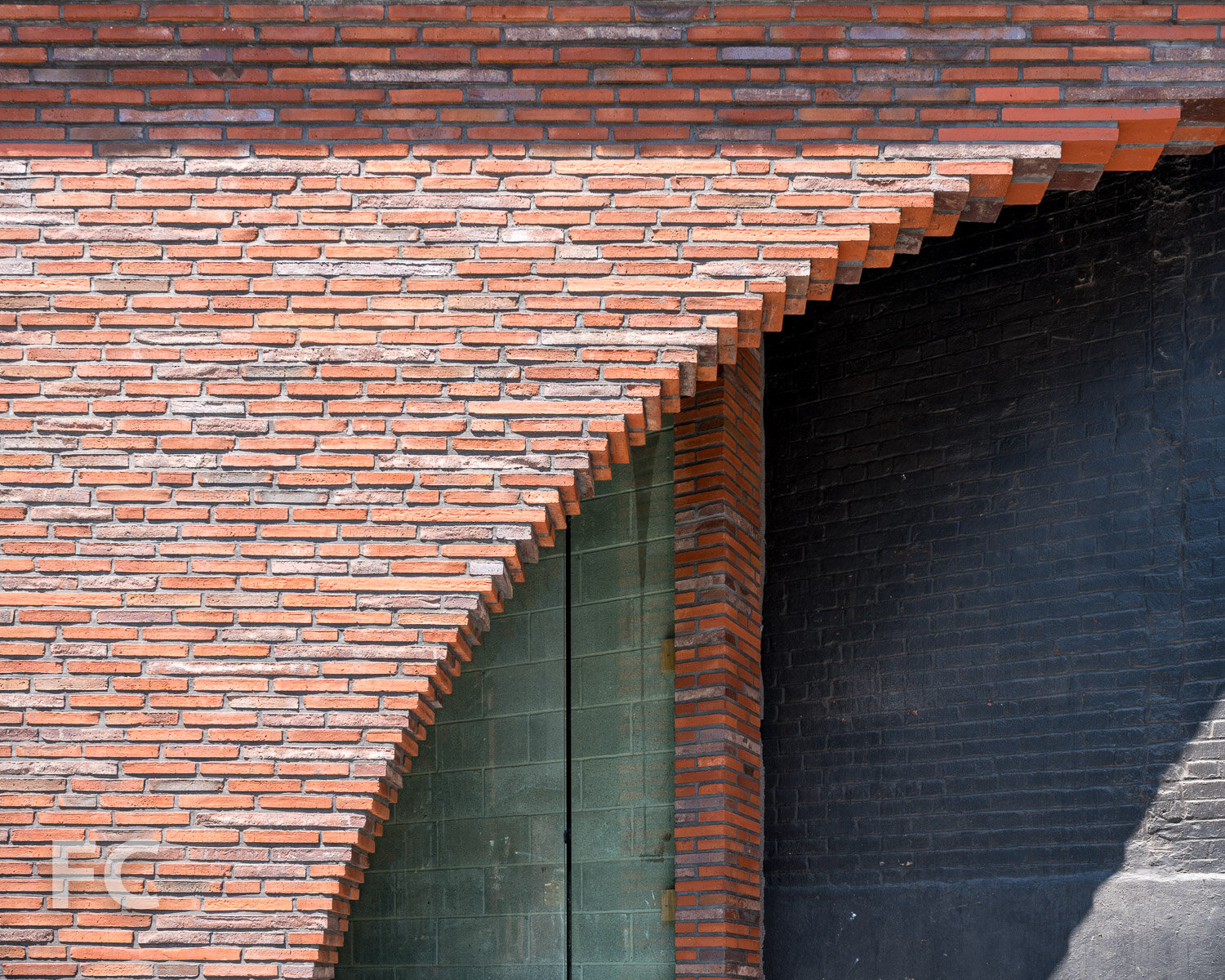 Close-up of the brick detailing at the ground floor storefront.