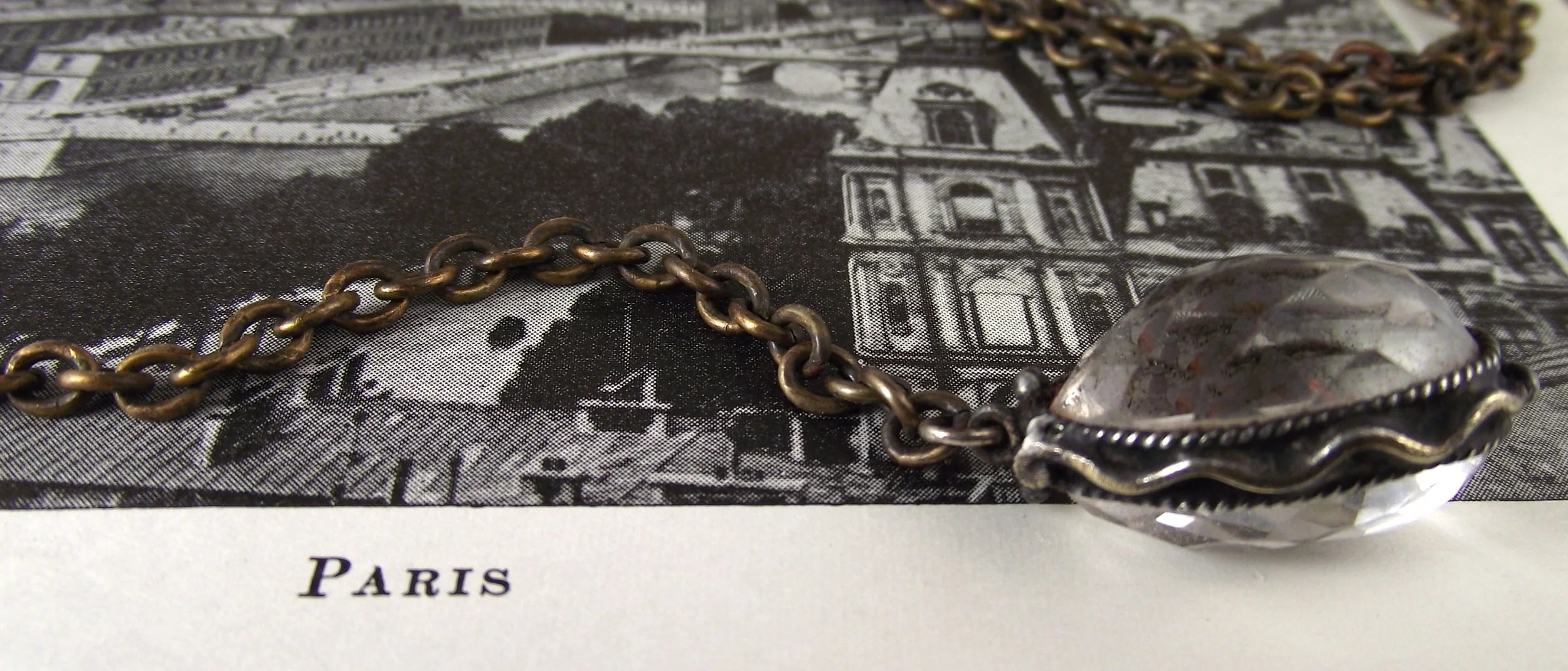 rock crystal rosary nugget w wave detail web on book.jpg