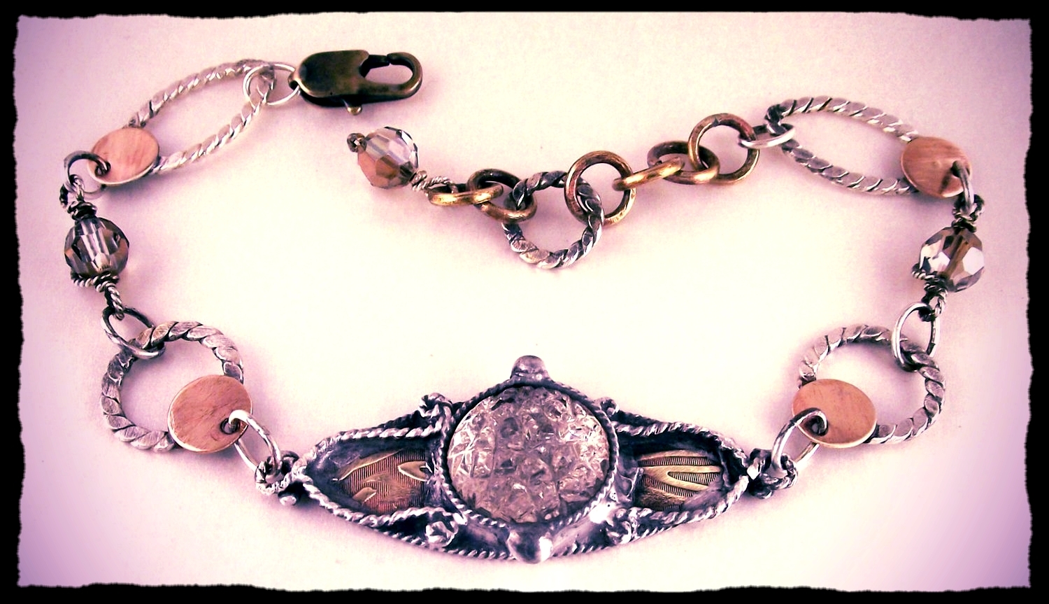 Romantic eye bracelet set with vintage crystal in hand-fabricated navette, hand-fabricated sterling and brass rings. Swarovski crystal beads.
