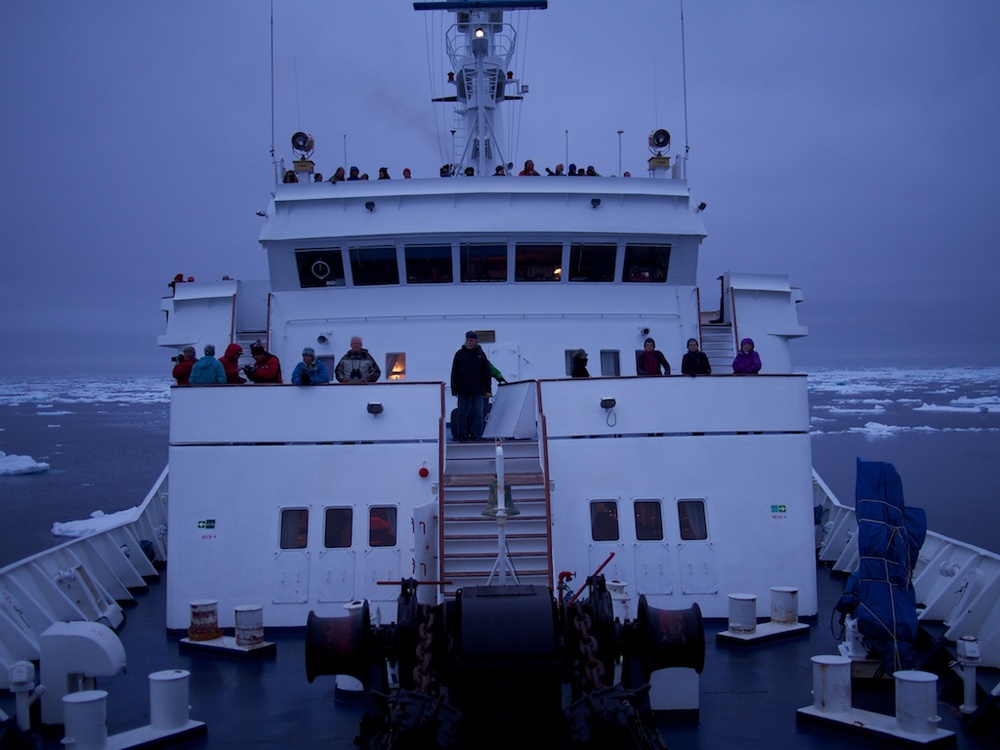 The Sea Adventurer navigating the pack ice in the late night twilight