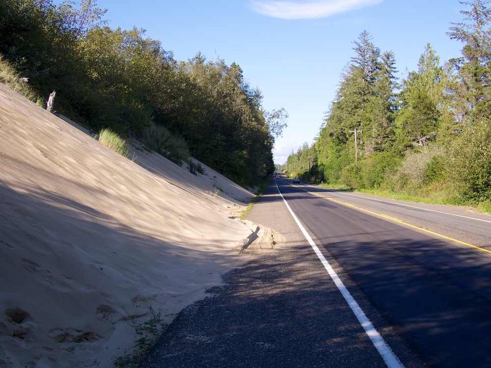 Encroaching sand onto the highway.