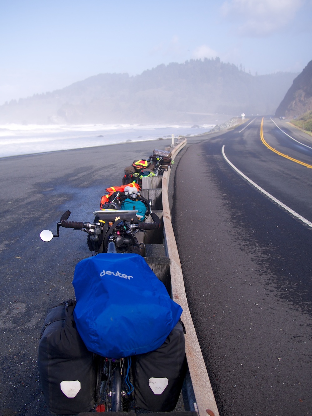 Resting with the gang along the seaside on the 101 after waiting out a storm the day before.