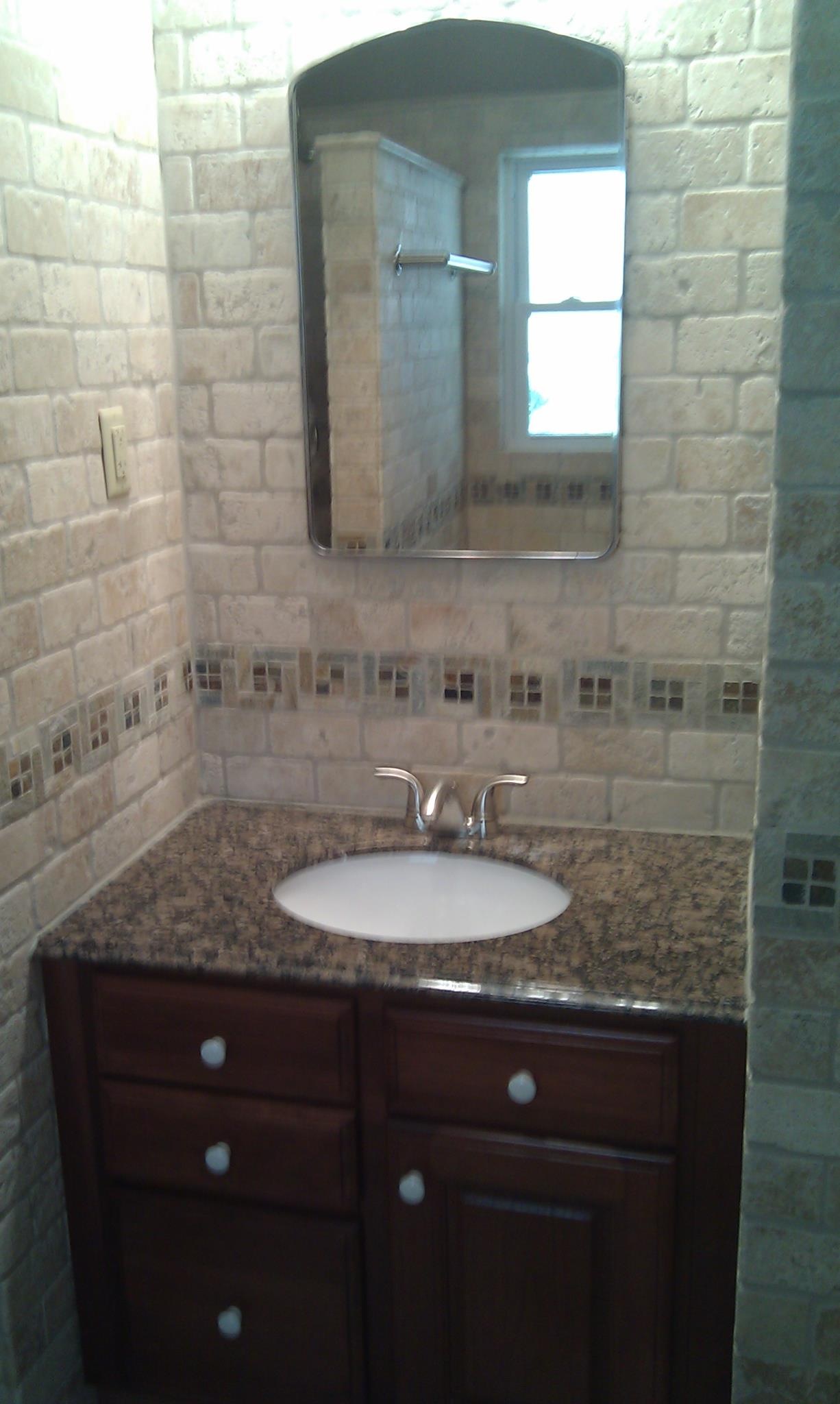 Mix our travertine with our granite vanity tops