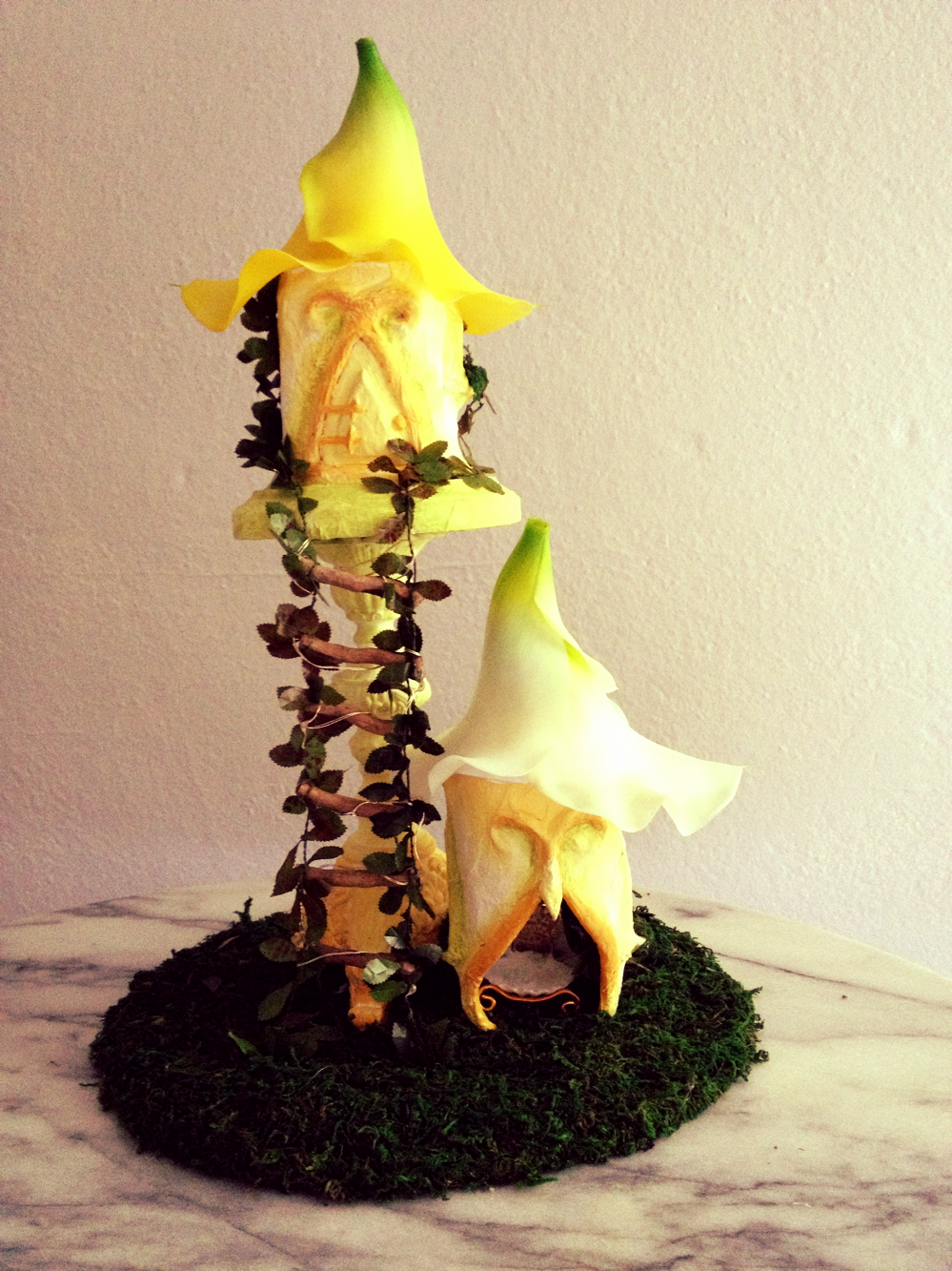 A cascading garland ladder and a lily roof