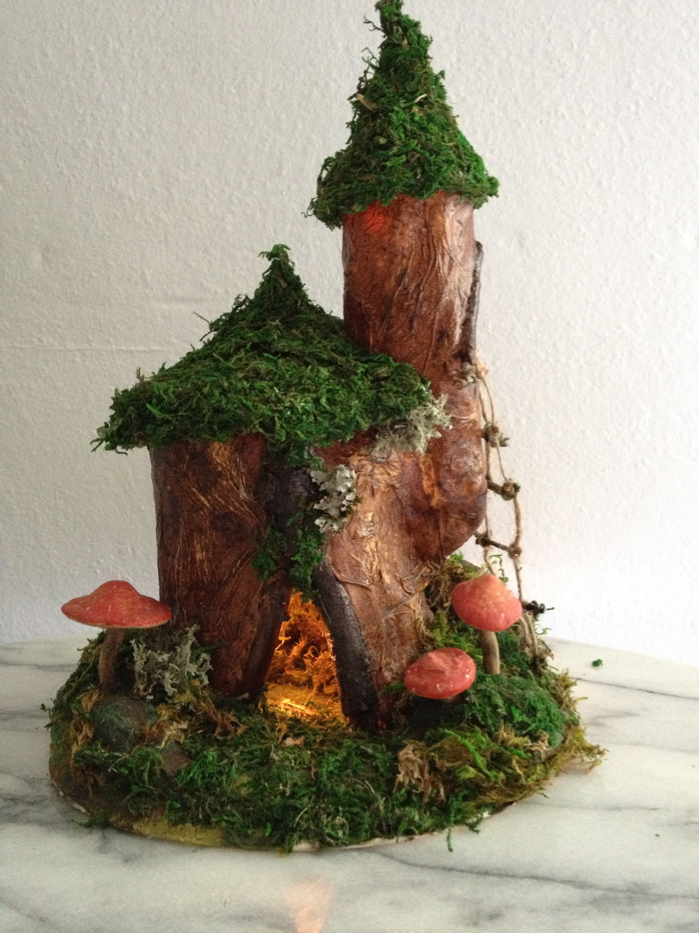 A rustic, mossy forest fairy dwelling
