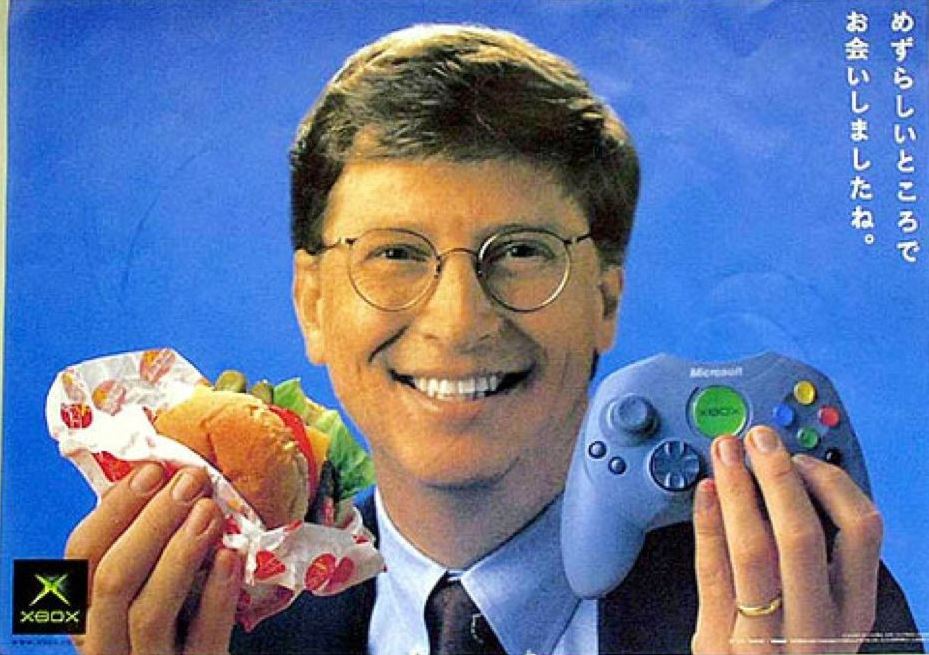 Microsoft co-founder Bill Gates showing the Japanese launch controller, almost identical to the "S" version that superseeded the "Duke" in Western regions.