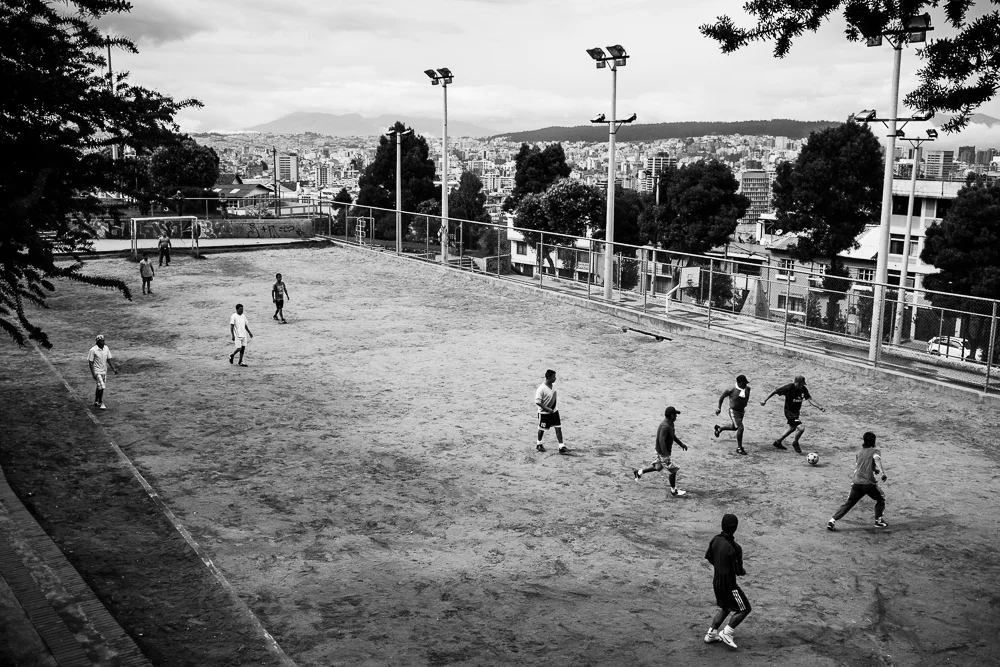 A pick-up soccer game on a field overlooking Quito, Ecuador. 05 June 2014, Photo by Bear Guerra