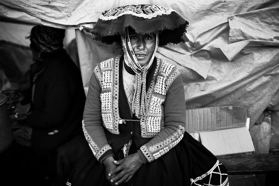 Portrait of a Quechua woman in traditional dress in Ocongate, Peru. 