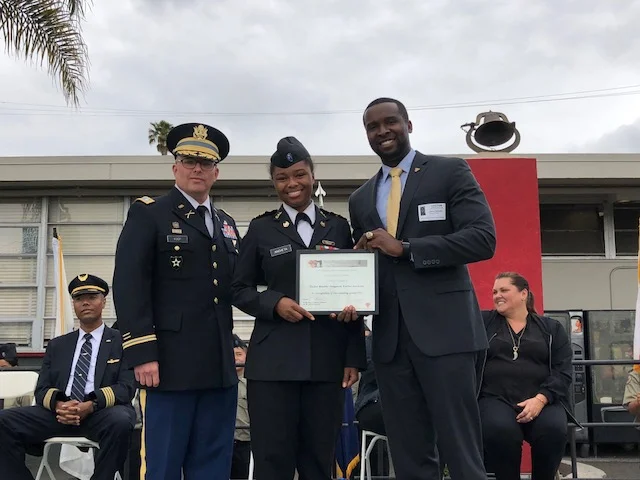 LTC Ken Coop (OMI Commandant) and Jerry Varnado '07 presenting a leadership award