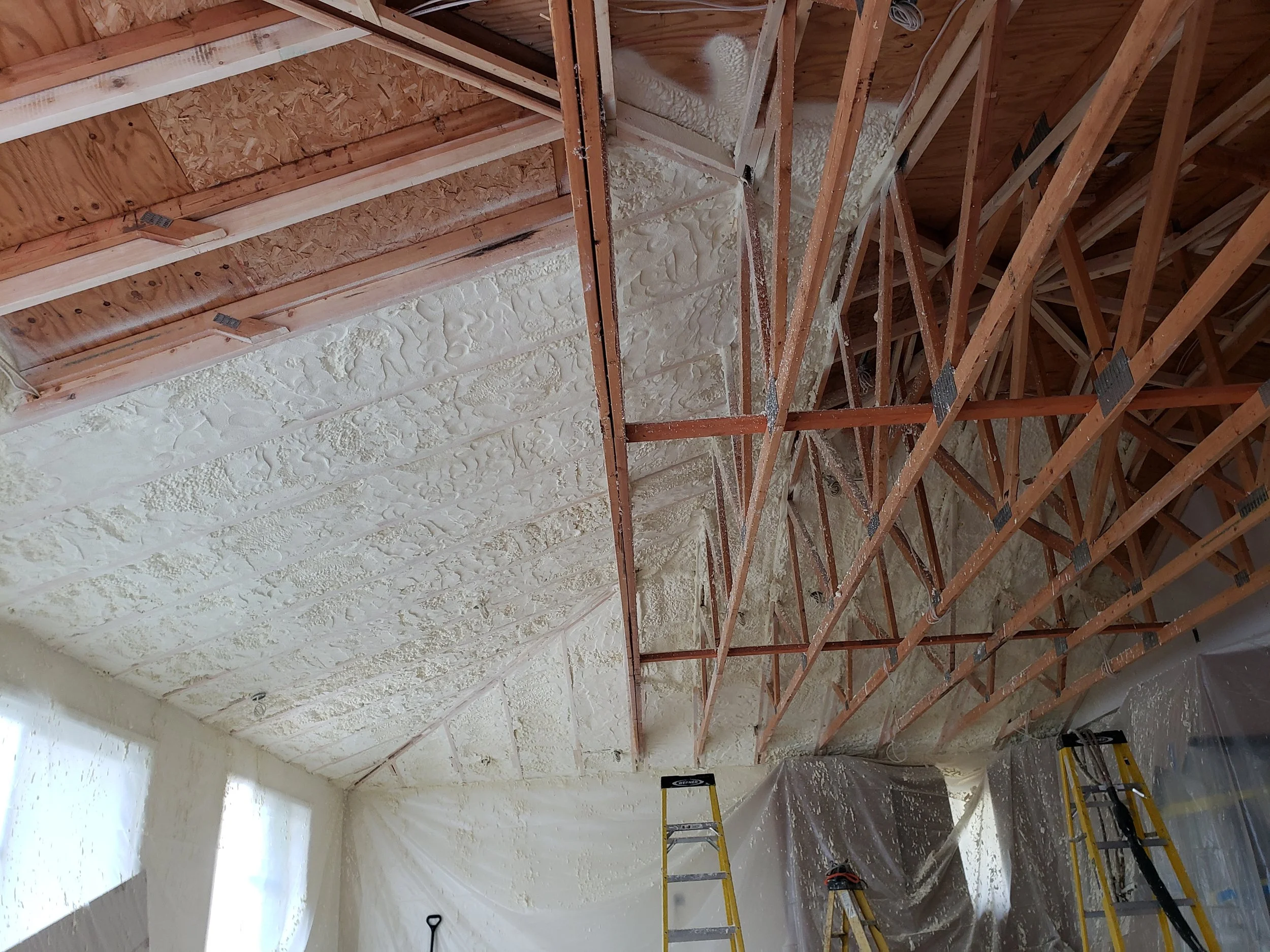 Installing 7" closed cell foam in a hot roof exposed truss application