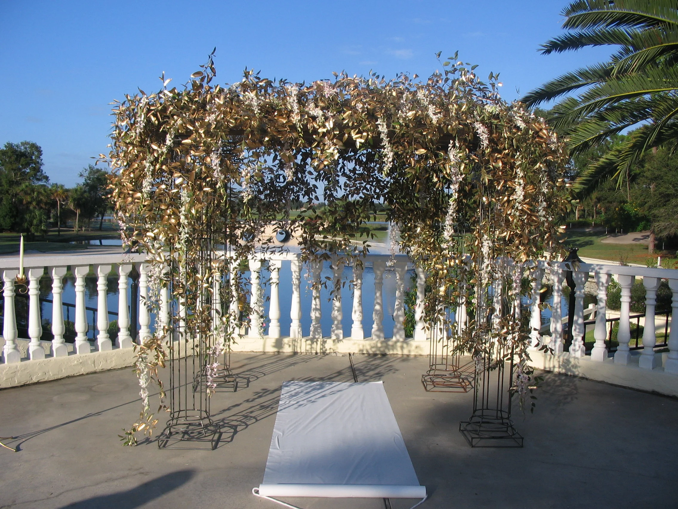 Wrought Iron Archway/Gazebo- $350 (Additional charges for Foliage and Flowers as seen in picture.)