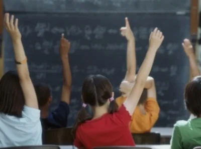 hands-raised-in-classroom.jpg