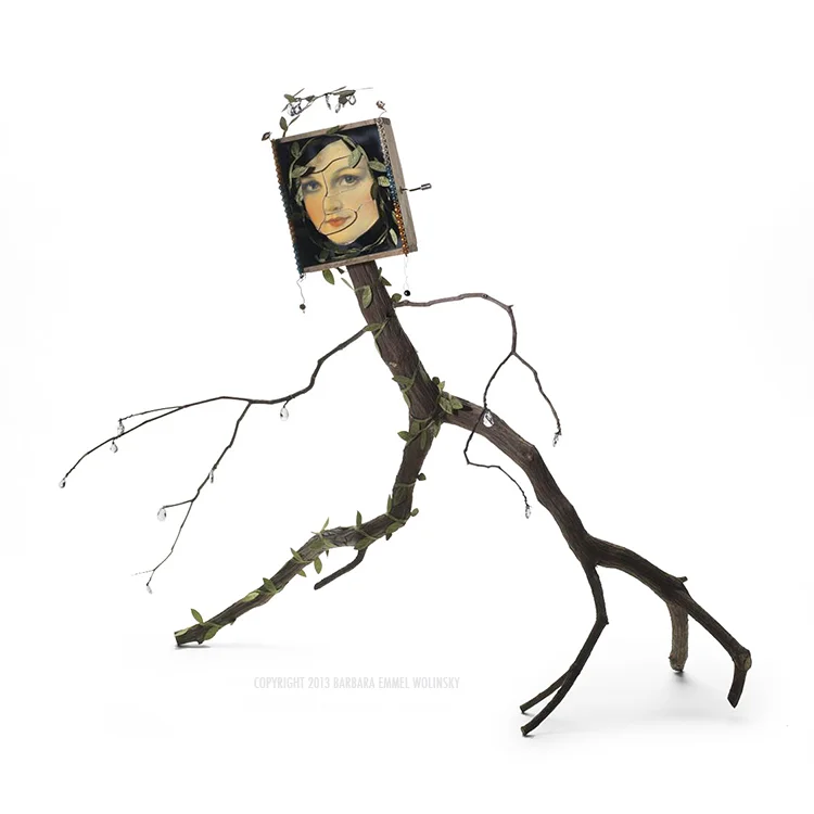 TAKING THE STAIRWAY TO HEAVEN 23" X 20" X 9" mountain laurel branches, leaf ribbon, wire, puzzle pieces and a music box