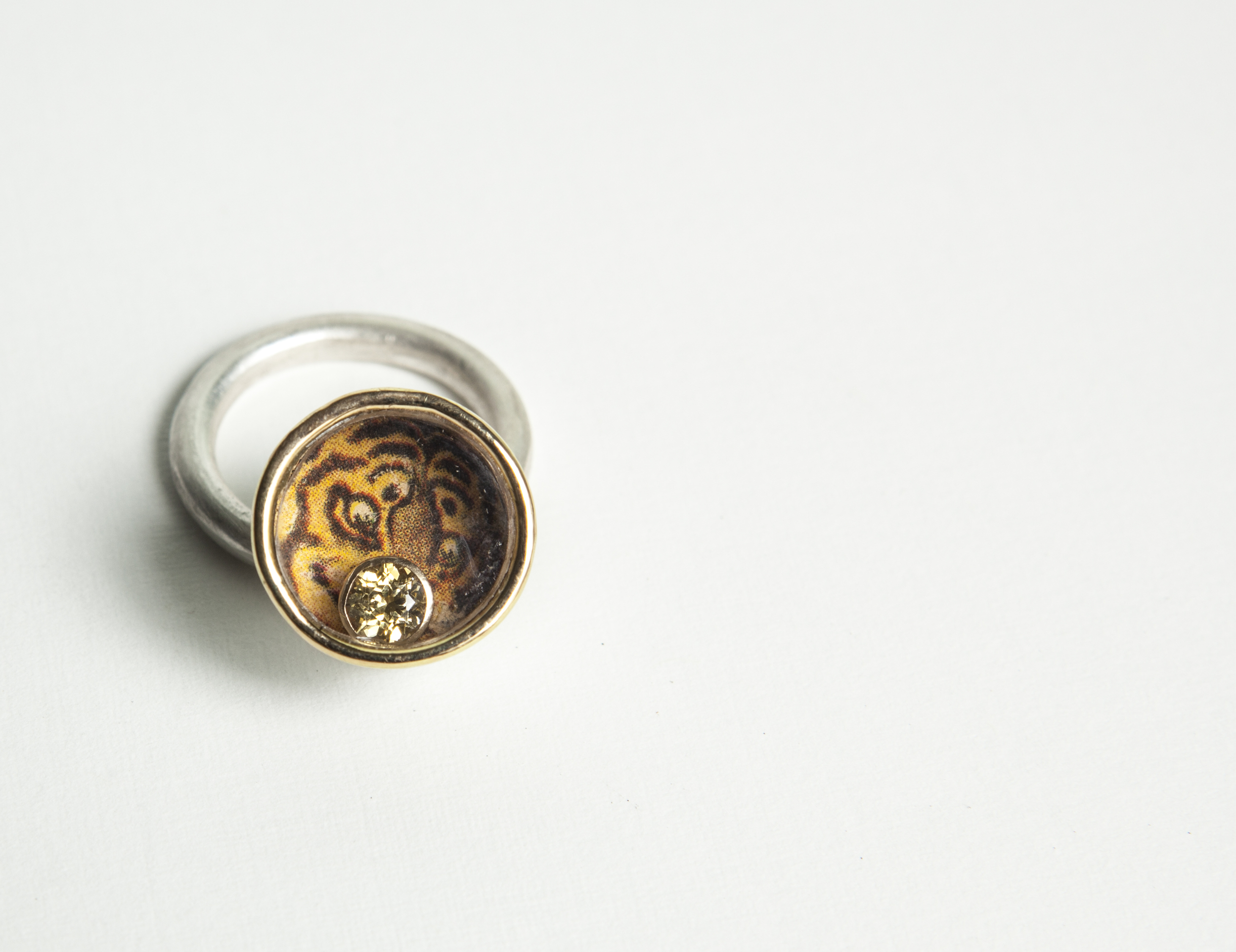  ​Ring  Sterling silver, gold, paper, 5mm yellow sapphire.  ​ 